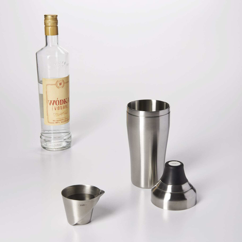 angled stainless steel jigger with cocktail shaker