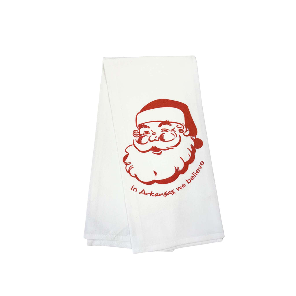 Dishtowel with santa design and the words "In Arkansas, we believe"