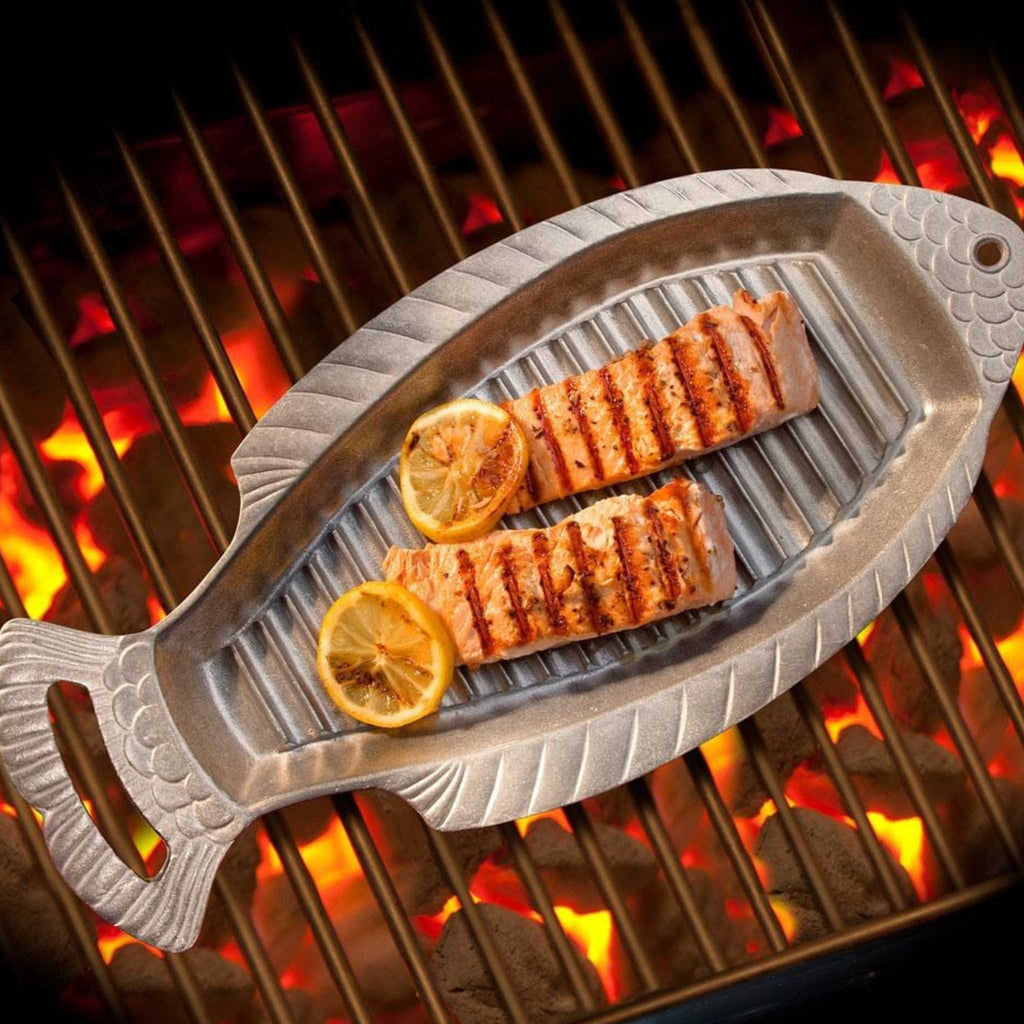 Wilton Armetale fish griller on the grill with fish.