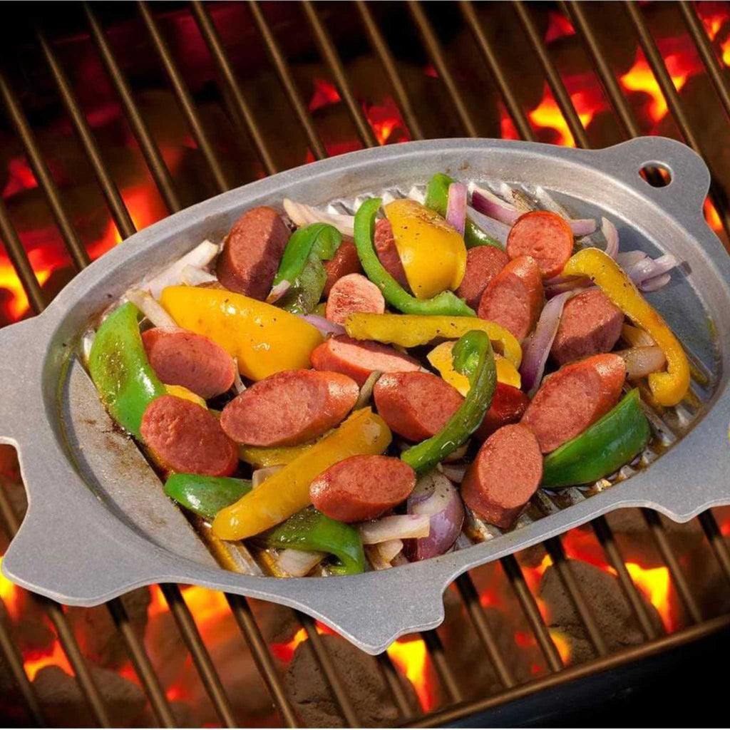 Wilton Armetale pig griller on the grill with meat and veggies
