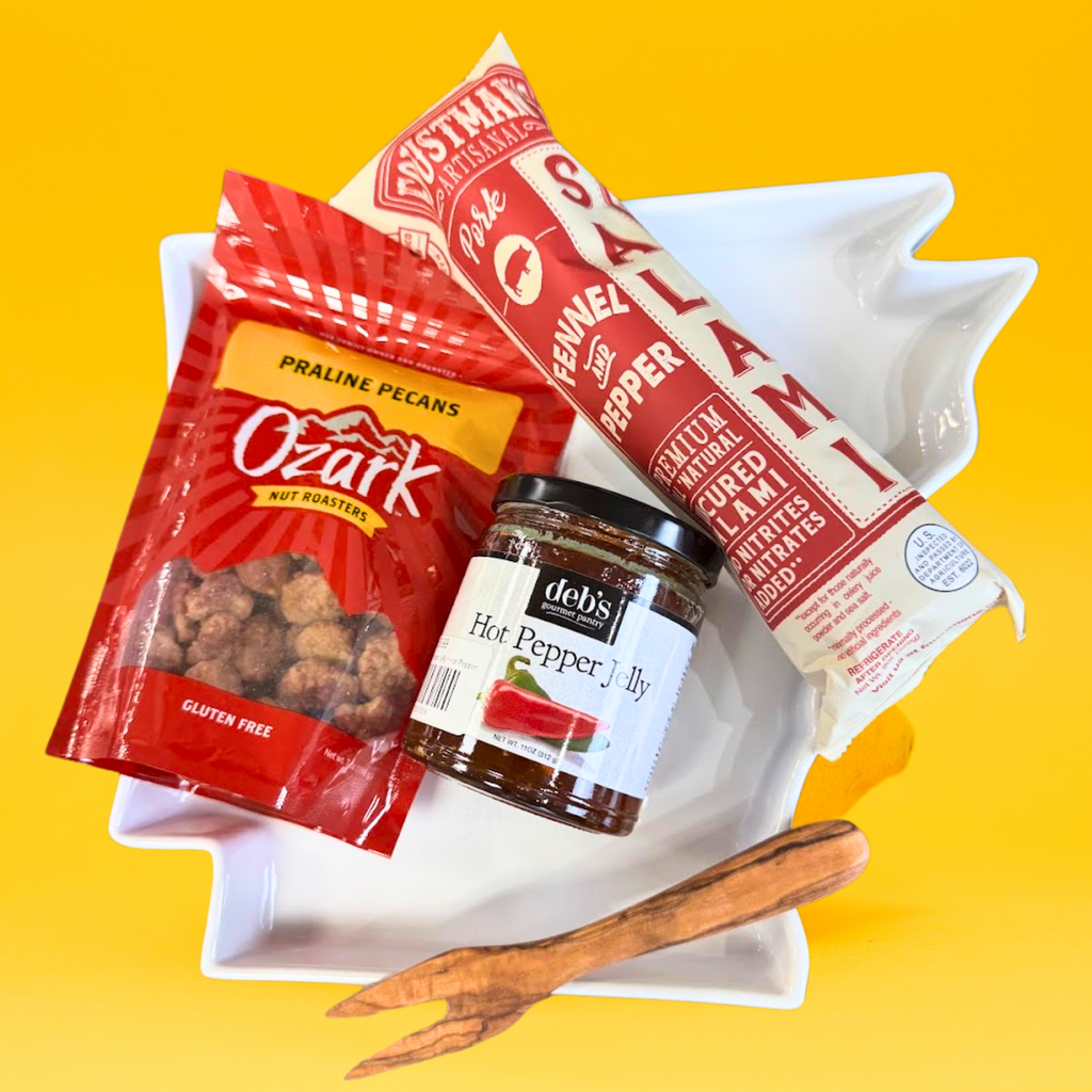 Corporate gift charcuterie package against a bright yellow background