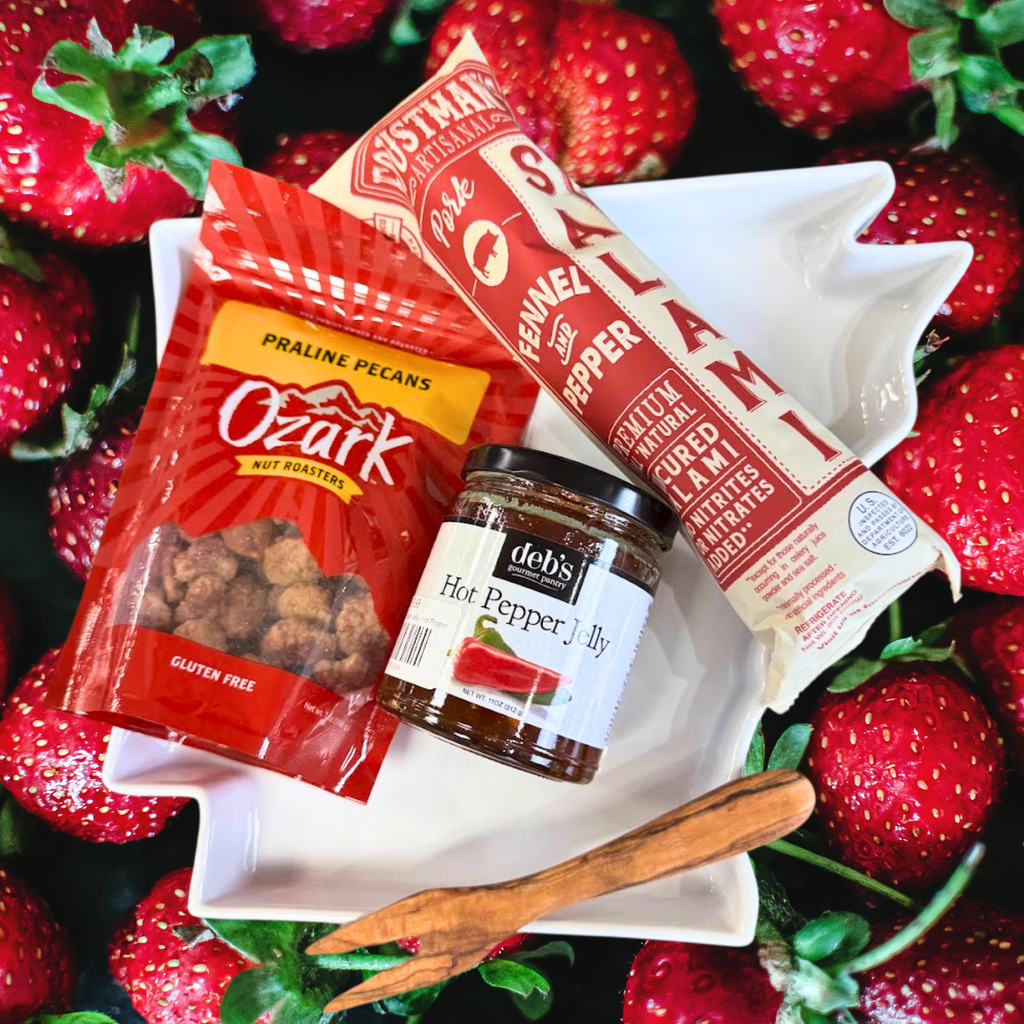 Corporate gift charcuterie package against a background of strawberries