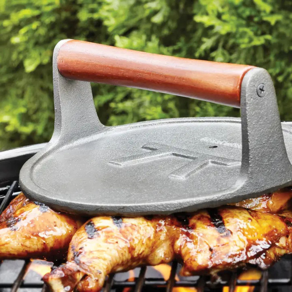 Cast Iron Round Grill Press in use