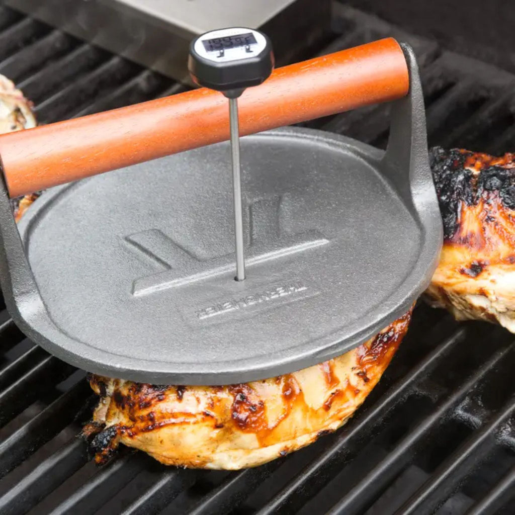 Cast Iron Round Grill Press in use
